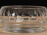 a glass bowl that has a word etched on it