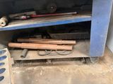 a blue cabinet with tools on top of it