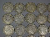 a lot of coins that are sitting on a table
