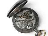 an old pocket watch with a chain attached to it