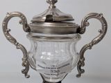 a silver trophy that is sitting on top of a table