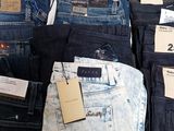 a lot of jeans that are on display in a store