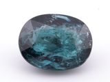 a blue green tourmaline gems on a white background