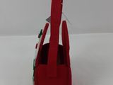 a small red bag with a handle on a white surface