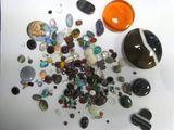 a lot of different colored stones on the table
