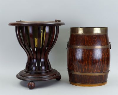 pair of wooden vases with brass rims on stands