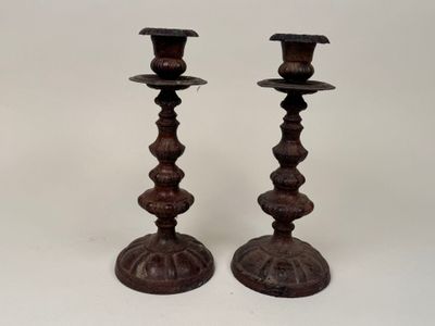 pair of antique cast iron candlesticks