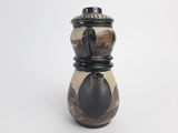 a black and white vase on a white background