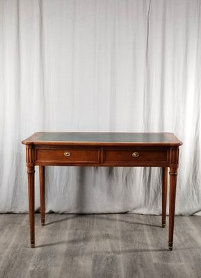 un bureau en bois avec deux tiroirs et un plateau en verre