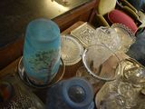 a table that has a lot of glass dishes on it