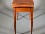 an image of a small wooden table with a drawer underneath it