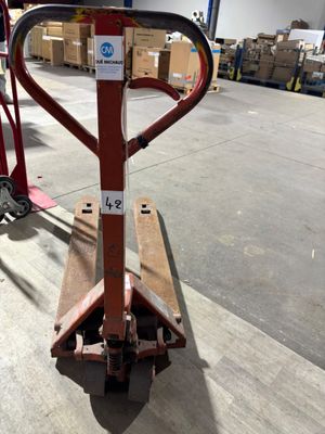an image of a fork lifter in a warehouse