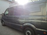 a black van that is parked on the side of the road