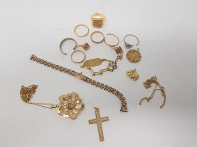 several gold rings, bracelets, rings, and rings on a white surface