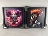 two framed pictures of a man with a mohawk and a woman with a skull