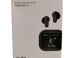 a box with a watch and earphones inside of it