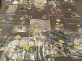 a lot of plastic bags on the floor covered with post it notes