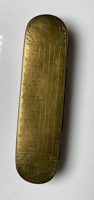 a gold case that is sitting on a white surface