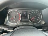 a close up of a car dashboard with a speedometer and gauges