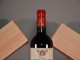a bottle of wine that is sitting on a table