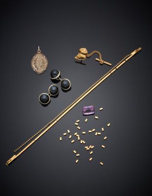 a collection of jewellery including a wand, earrings and a necklace