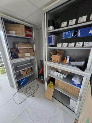 a room with a lot of boxes and boxes on the shelves