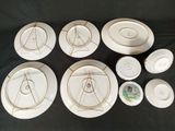 many plates and bowls that are sitting on a table