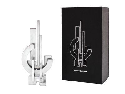 a close up of a bottle of perfume next to a box