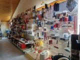 many tools on the wall in this shop