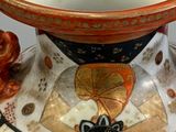 a large vase with a decorative design on it
