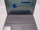 an open laptop computer sitting on top of a white table