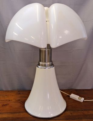 an image of a white table lamp on a wooden table