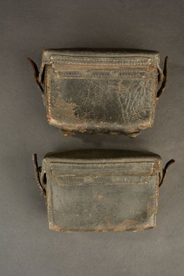 two pieces of luggage that are sitting on a table