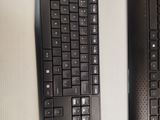 two keyboards and a mouse sitting on a table