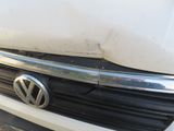 a close up of the front grille of a white car
