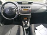 the interior of a car with a steering wheel and dashboard controls