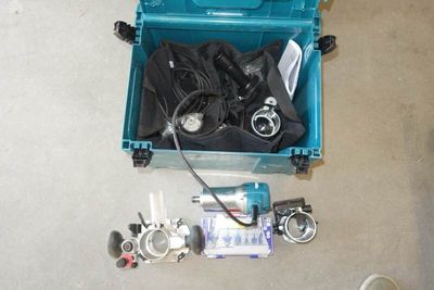 a blue box filled with scuba equipment on the floor
