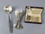 a silverware set with spoons and spoons in a box