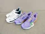 three pairs of tennis shoes are lined up in a row