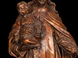 an image of a statue of a woman holding a child