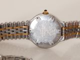 a close up of a watch on a table