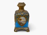 a blue and gold vase with a picture on it