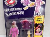 a close up of a toy figure of a woman in a pink outfit