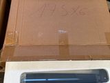 a box that has a laptop in it on top of it
