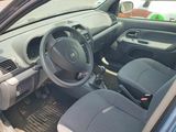 the interior of a car with the door open and the driver ' s seat down
