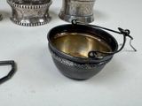 a lot of silver items that are on the table