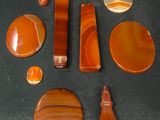 several pieces of agate are arranged in a circle on a black surface
