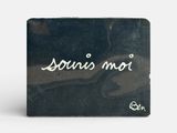 louis mou wallet in black with white writing on the front
