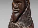 an image of a sculpture of a man with a hat on his head