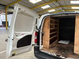 a white van that is open in a building